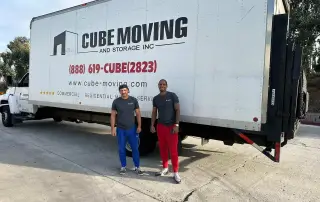 a bright, sunny san diego skyline provides a vibrant backdrop as a diverse group of joyful families and professionals collaboratively discusses moving options, showcasing the friendly atmosphere of selecting the right affordable moving company.