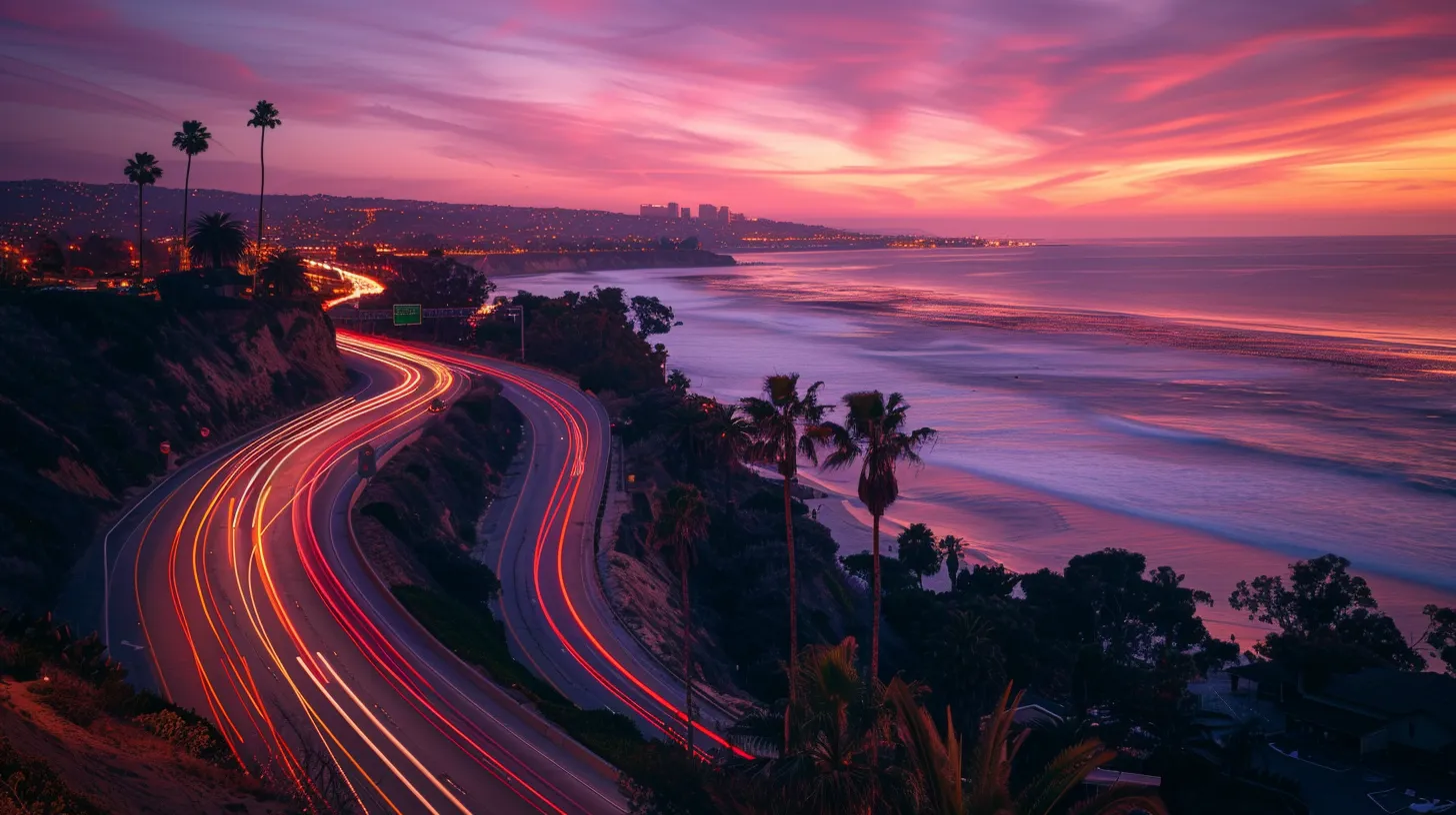 a vibrant sunset view over a scenic coastal highway, illustrating the journey from los angeles to san diego with palm trees lining the roadside and waves crashing in the distance.